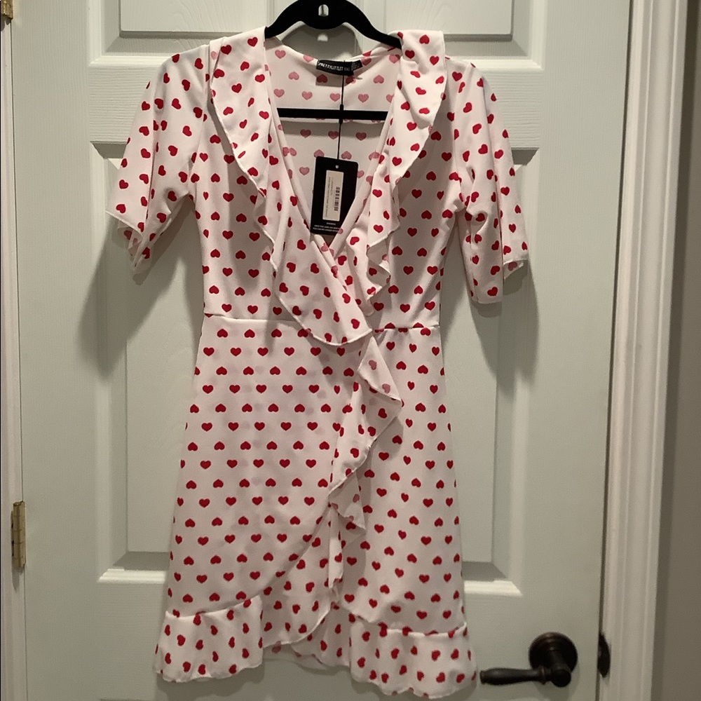 Pretty little thing heart print faux wrap dress. Size 4.